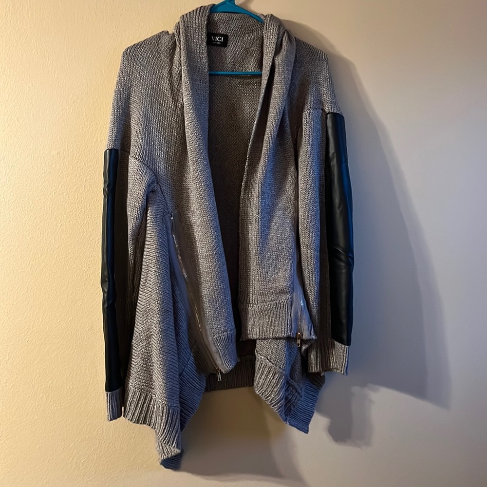 Knit VICI Cardigan with leather sleeves and zippered sides.